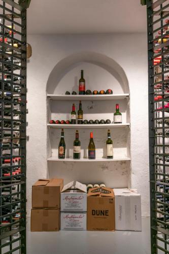 a wine cellar with shelves with bottles of wine at Villa Gransholm in Gemla