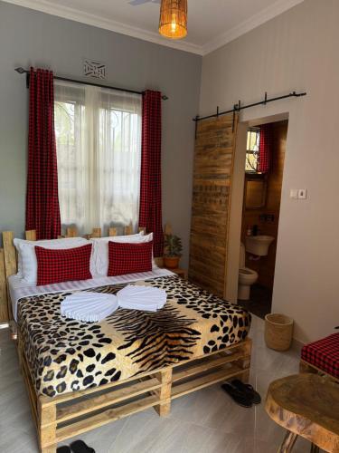 Llit o llits en una habitació de Baraka Home