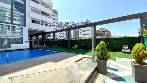an apartment with a swimming pool in a building at Tanger City 2 in Tangier