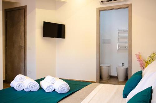 Postel nebo postele na pokoji v ubytování La Corte di Giovanni - Guest House