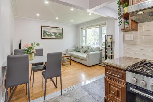 a kitchen and living room with a table and chairs at Beautiful house near bluffers beach, 25 minutes to Toronto Downtown, free parking, and wifi in Toronto