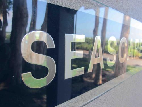 a sign that says saks on the side of a building at Seascape Luxury Beachfront House in Clifton Beach