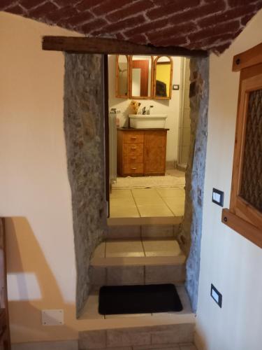 a bathroom with a sink and a mirror at La SELVA in Vistrorio