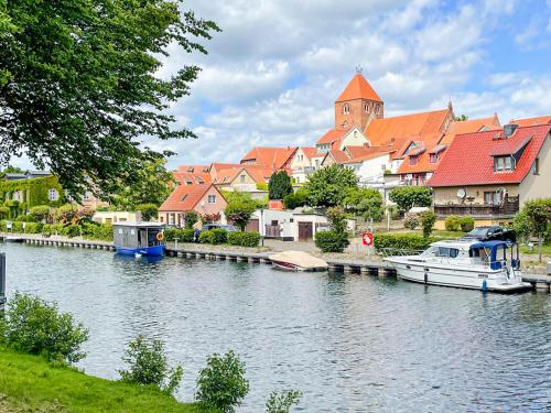 a river with boats in a town with a church at Bungalow 2 in Quetzin
