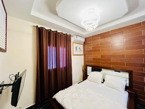 Ένα ή περισσότερα κρεβάτια σε δωμάτιο στο Hôtel Les Mamelles