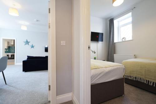 Ένα ή περισσότερα κρεβάτια σε δωμάτιο στο Modern 3Bed, Wi-Fi, Dining for 6
