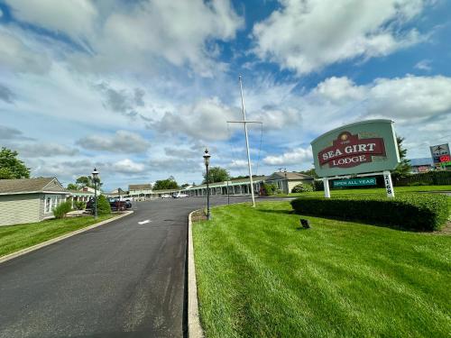a sign for a real car dealership on the side of a road at Sea Girt Lodge in Sea Girt