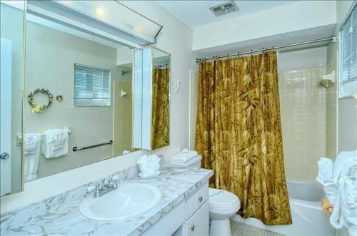 a bathroom with a sink and a toilet and a shower at Crescent Royale 515 in Siesta Key