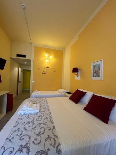 Postel nebo postele na pokoji v ubytování Hotel Duca Della Corgna