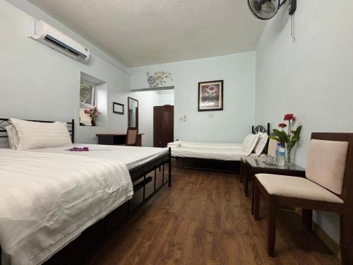 Una cama o camas en una habitación de Chân Mây Tam Đảo