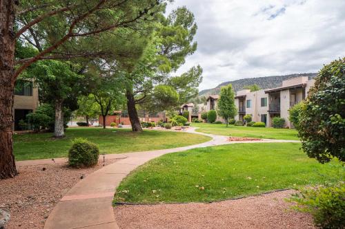 a walkway through a park with trees and buildings at Charming Sedona Stay with Community Spa & Pool in Sedona