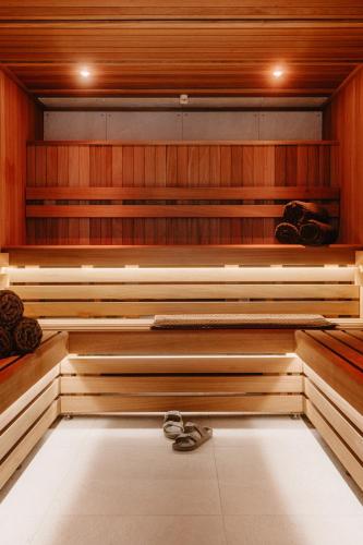 a sauna with a pair of shoes sitting in it at Mason & Fifth, Westbourne Park in London