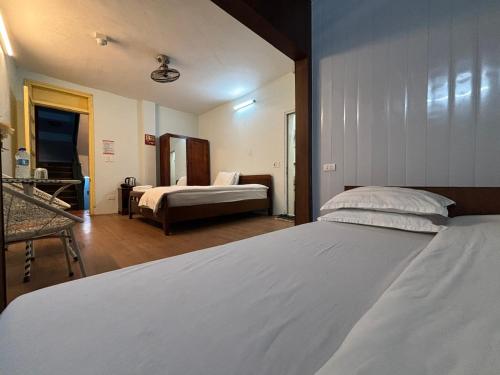 Una cama o camas en una habitación de Chân Mây Tam Đảo