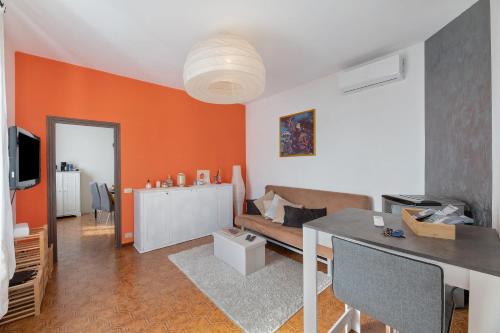 a living room with a couch and a table at Suite panoramica in Guest House in Moltrasio