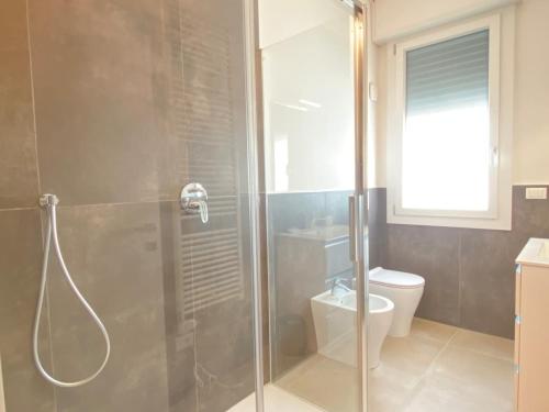 a bathroom with a shower and a toilet at Suite Emilia 6 in Bologna