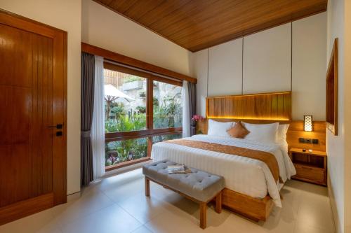 Ένα ή περισσότερα κρεβάτια σε δωμάτιο στο Joon Canggu Apartment