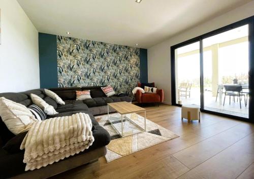 a living room with a couch and a table at Perry in Mialos