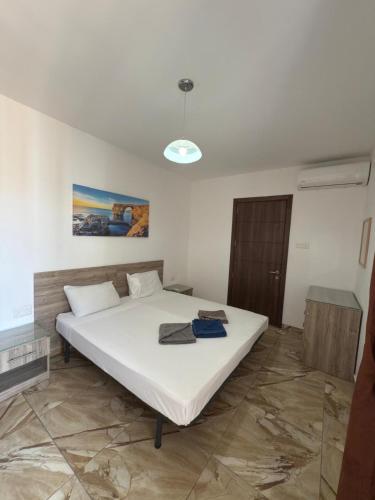 Ένα ή περισσότερα κρεβάτια σε δωμάτιο στο 3-Bedroom Apartment in Msida M5