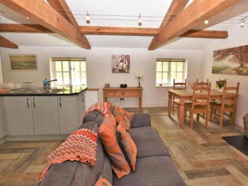 a living room with a couch and a table at 2 Bed in Botusfleming 58966 in Landrake