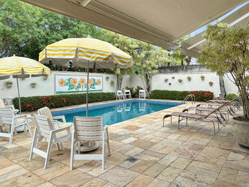 Πισίνα στο ή κοντά στο Piscina Churrasqueira Suíte 200m do Mar AC