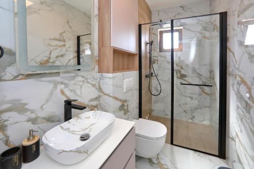 a bathroom with a sink and a shower at Apartment Ante in Bibinje