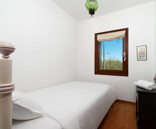 a white bedroom with a bed and a window at Sea & Salt ,Pelion,Agria Volos in Agria