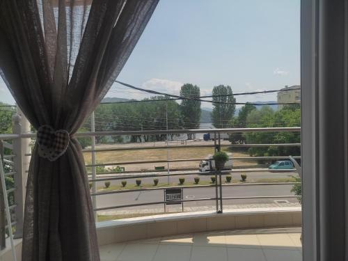 a room with a window with a view of a highway at Filareti studios in Kastoria