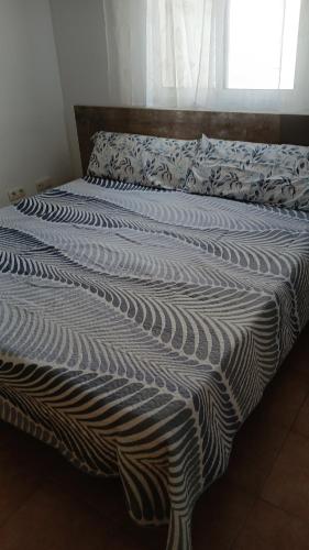 Ένα ή περισσότερα κρεβάτια σε δωμάτιο στο Bonito apartamento en Garrucha