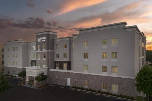 a rendering of the exterior of a hotel at Homewood Suites by Hilton Metairie New Orleans in Metairie