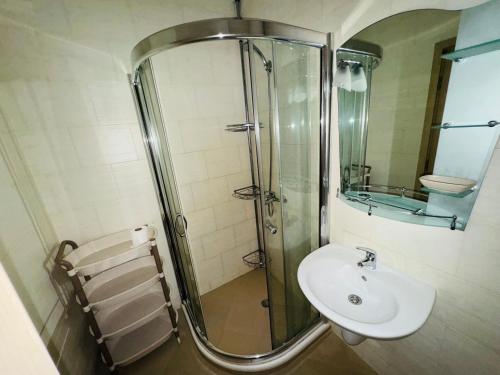 a bathroom with a glass shower and a sink at KALIA C9 One Bedroom Apartment in Sunny Beach