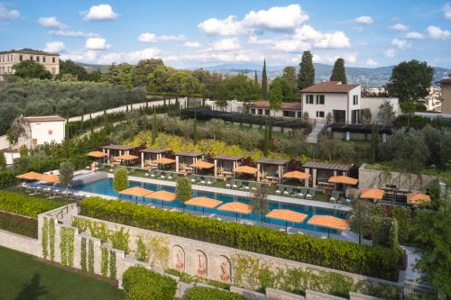 an aerial view of a resort with a swimming pool at Collegio alla Querce, Auberge Collection in Florence