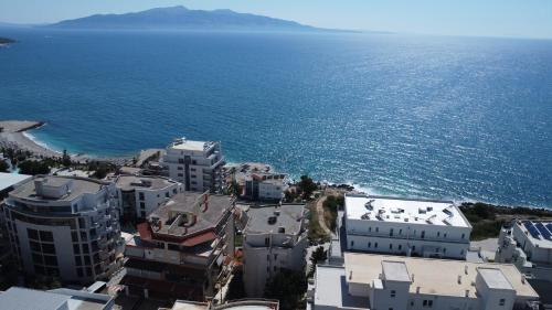 an aerial view of a city next to the ocean at Saranda Apartments in Sarandë