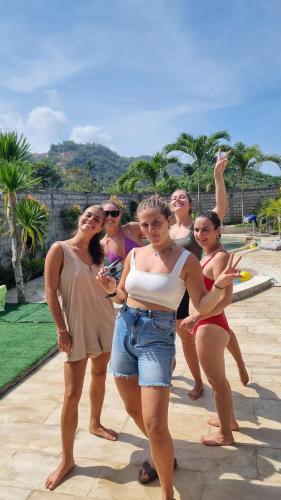 a group of women standing next to each other at Jancoox Hostel in Kuta Lombok
