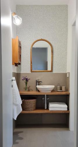 a bathroom with a sink and a mirror at LA CASETTA TRA i LAGHI in Omegna