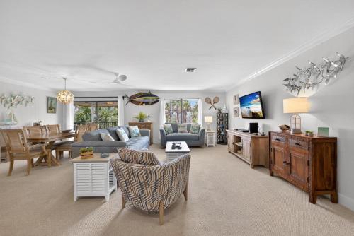a living room with a couch and a table at Blind Pass A205 in Sanibel