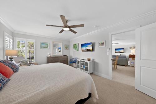 a bedroom with a bed and a ceiling fan at Blind Pass A205 in Sanibel