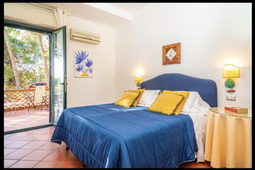 Ένα ή περισσότερα κρεβάτια σε δωμάτιο στο Villa delle Palme