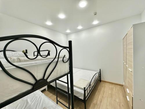 a bedroom with two bunk beds and a closet at Tsikhisdziri Apt Sleeps 5 in Tsikhisdziri