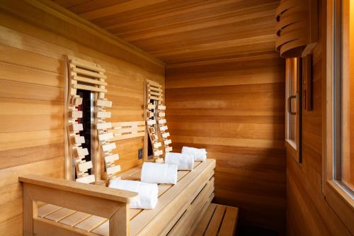 a sauna with white towels in a wooden cabin at Panoramasuite The Turm - Penthouse in Wustrow