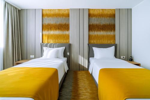 Postel nebo postele na pokoji v ubytování ARIS Boutique Hotel & SPA