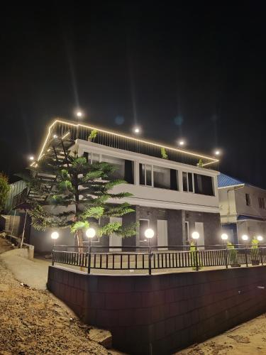 a building with lights on top of it at night at Moon Valley, kanthalloor in Kanthalloor