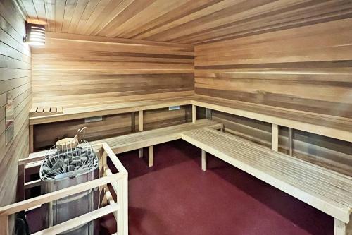 an empty sauna with wooden walls and benches at Woodbridge Unit 29E in Snowmass Village