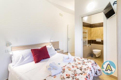 a bedroom with a bed with towels on it at L'isola felice in Silvi Marina
