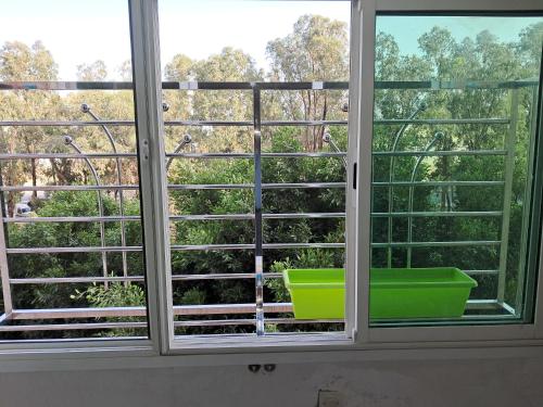 an open window with a view of trees at Meknès Escale in Meknès