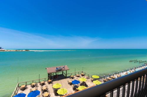 a view of a beach with umbrellas and the ocean at Holiday Inn & Suites Clearwater Beach by IHG in Clearwater Beach