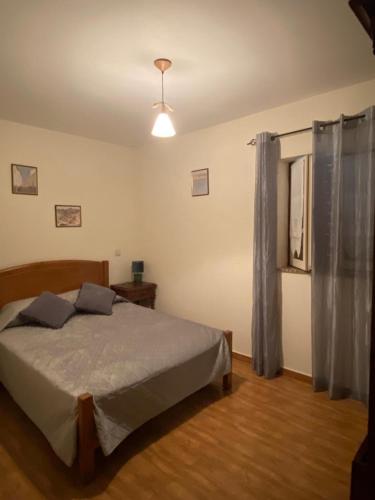 a bedroom with a bed in a room at Casa Sequeira de São José - Gerês in Terras de Bouro