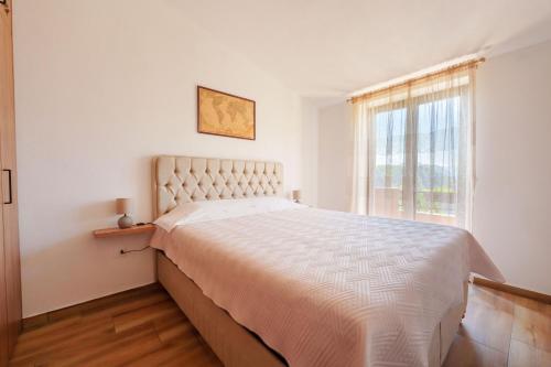 Ένα ή περισσότερα κρεβάτια σε δωμάτιο στο Big Hill Apartment 2