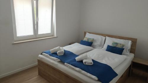 Postel nebo postele na pokoji v ubytování Apartmaji Sopotnik
