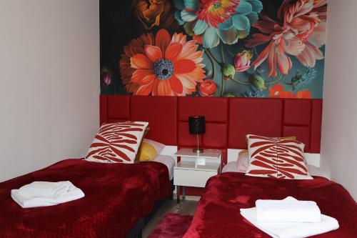 Katil atau katil-katil dalam bilik di Le Rose Suites & Park Hotel