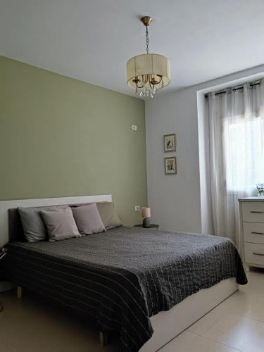מיטה או מיטות בחדר ב-Sofia Apartment